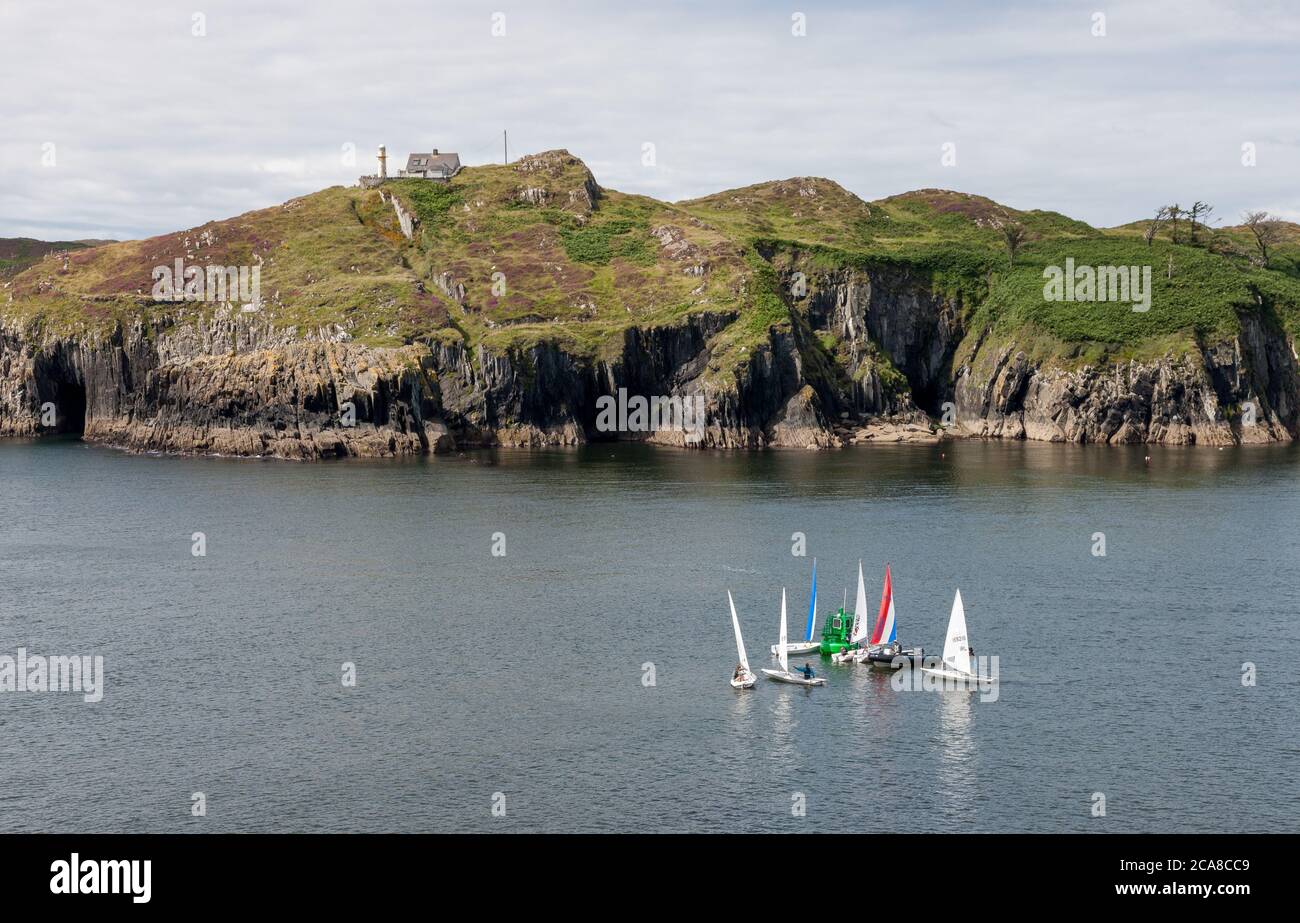Baltimore, Cork, Ireland. 03rd May,2020. Sailing boats at the mouth of the harbour with Sherkin Island in the background in Baltimore, Co. Cork, Irela Stock Photo