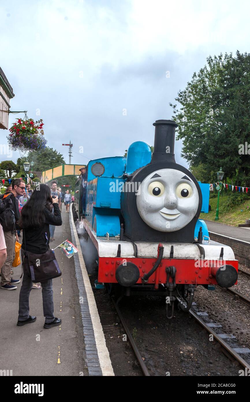 'Thomas the Tank Engine' pulling a children's excursion train out of Ropley station on the Mid-Hants Railway (the Watercress Line), Hampshire. UK Stock Photo