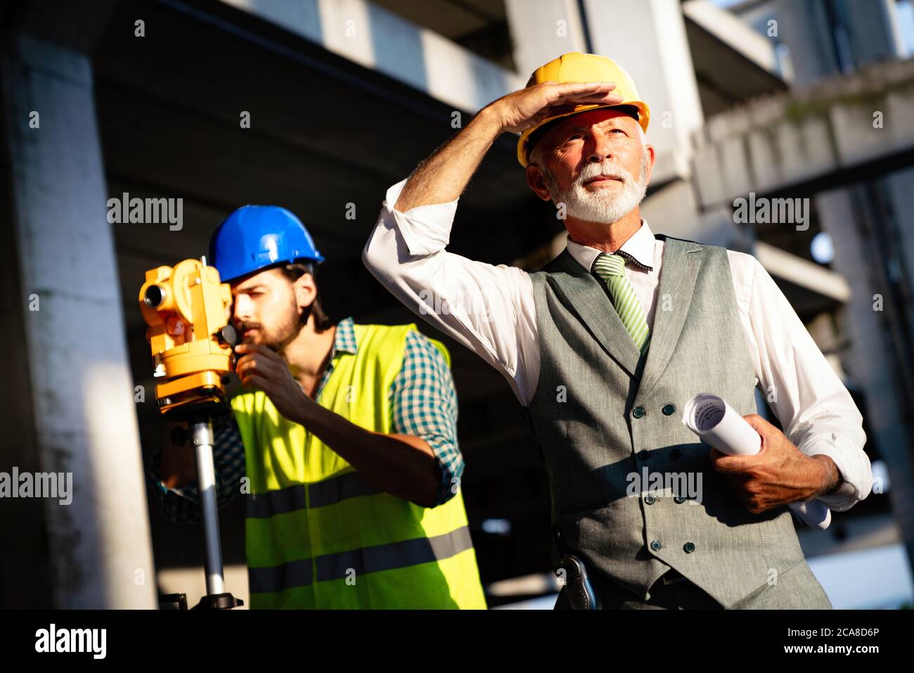 Engineer, contractor, architect teamwork. Construction people talking and planning work, blueprint Stock Photo
