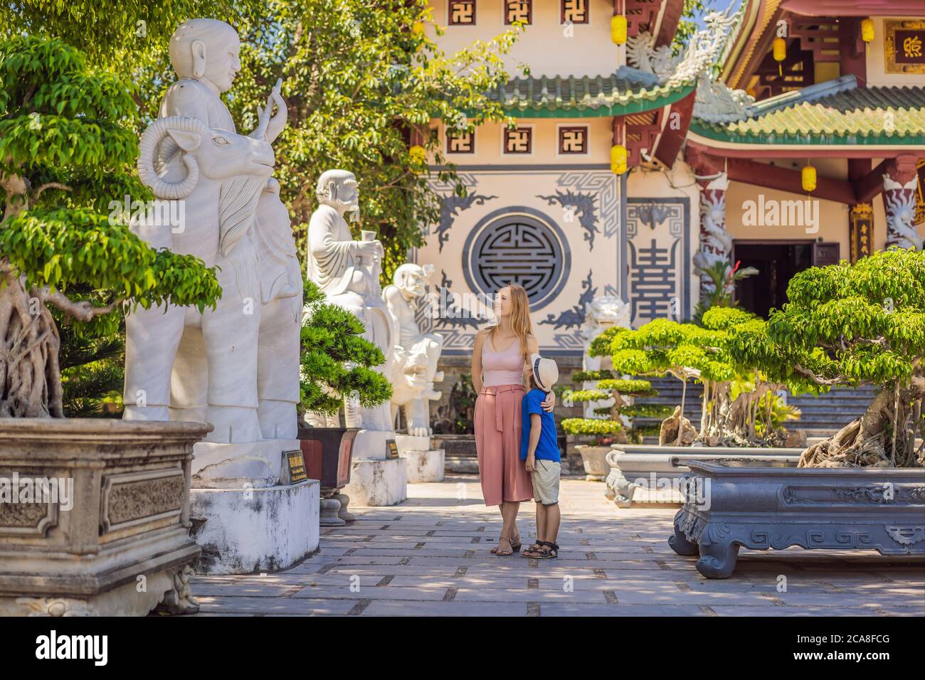 Mother and son tourists in Chua Linh Ung Bai But Temple, Lady Buddha Temple in Da Nang, Vietnam. Traveling with children concept Stock Photo