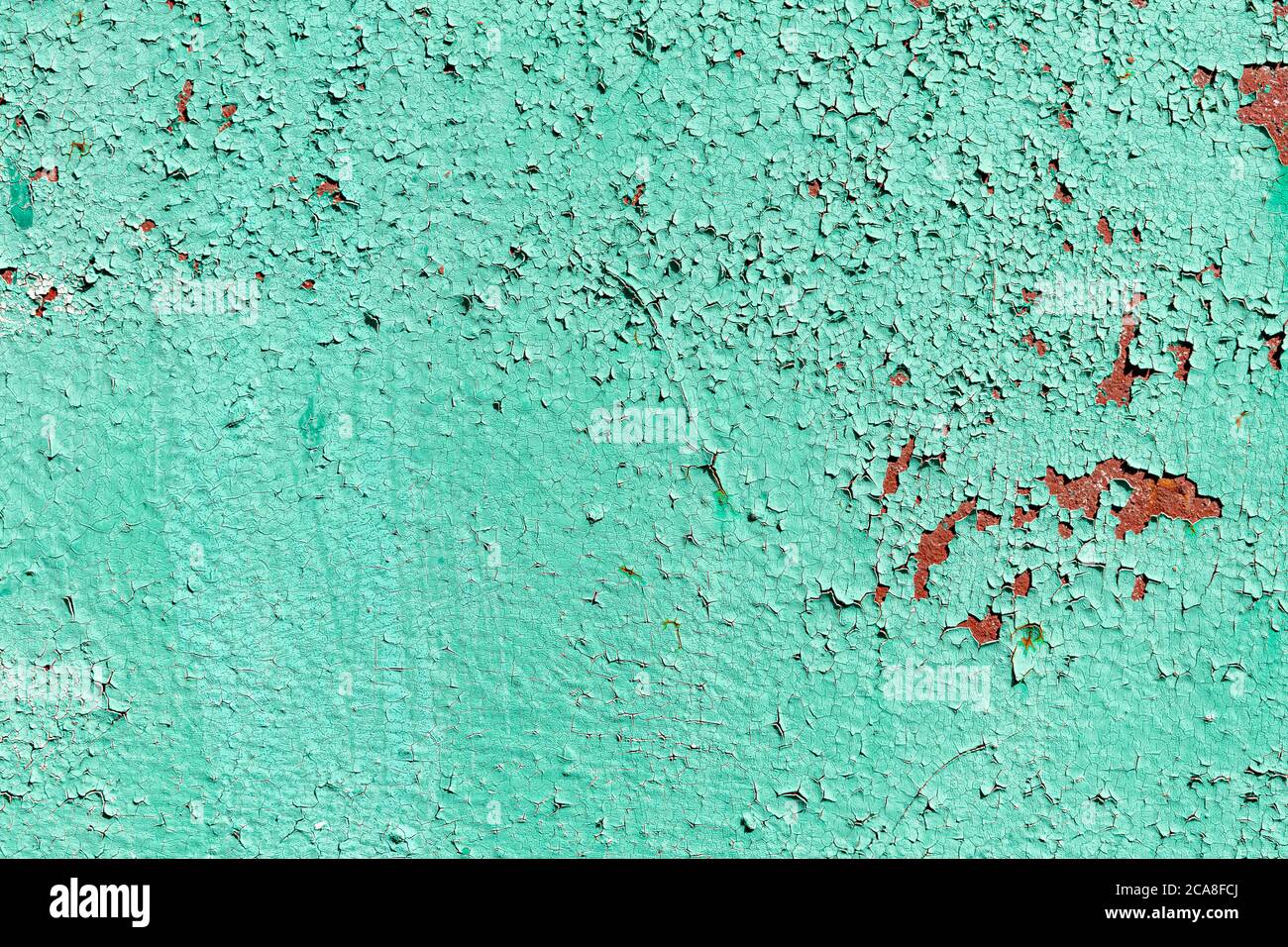 old rusty green iron surface. old paint is peeling off the surface Stock Photo