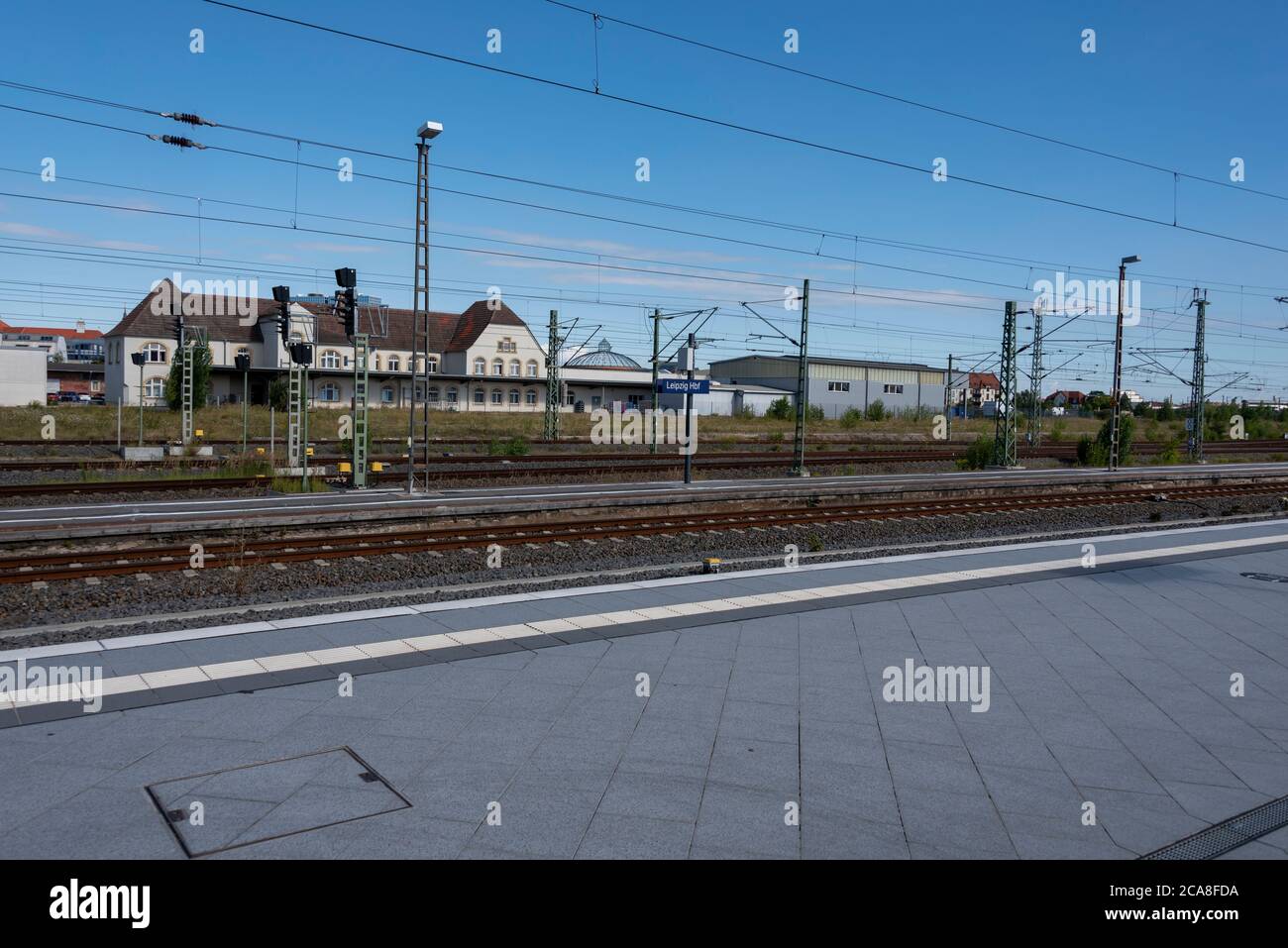 Leipzig, Germany. 29th July, 2020. The dome of the Gasometer Nord can be seen from the tracks of the main station. The round brick building from the Gründerzeit was built in 1890 and is a technical monument today. Credit: Stephan Schulz/dpa-Zentralbild/ZB/dpa/Alamy Live News Stock Photo