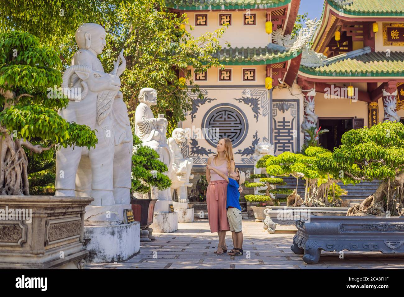 Mother and son tourists in Chua Linh Ung Bai But Temple, Lady Buddha Temple in Da Nang, Vietnam. Traveling with children concept Stock Photo