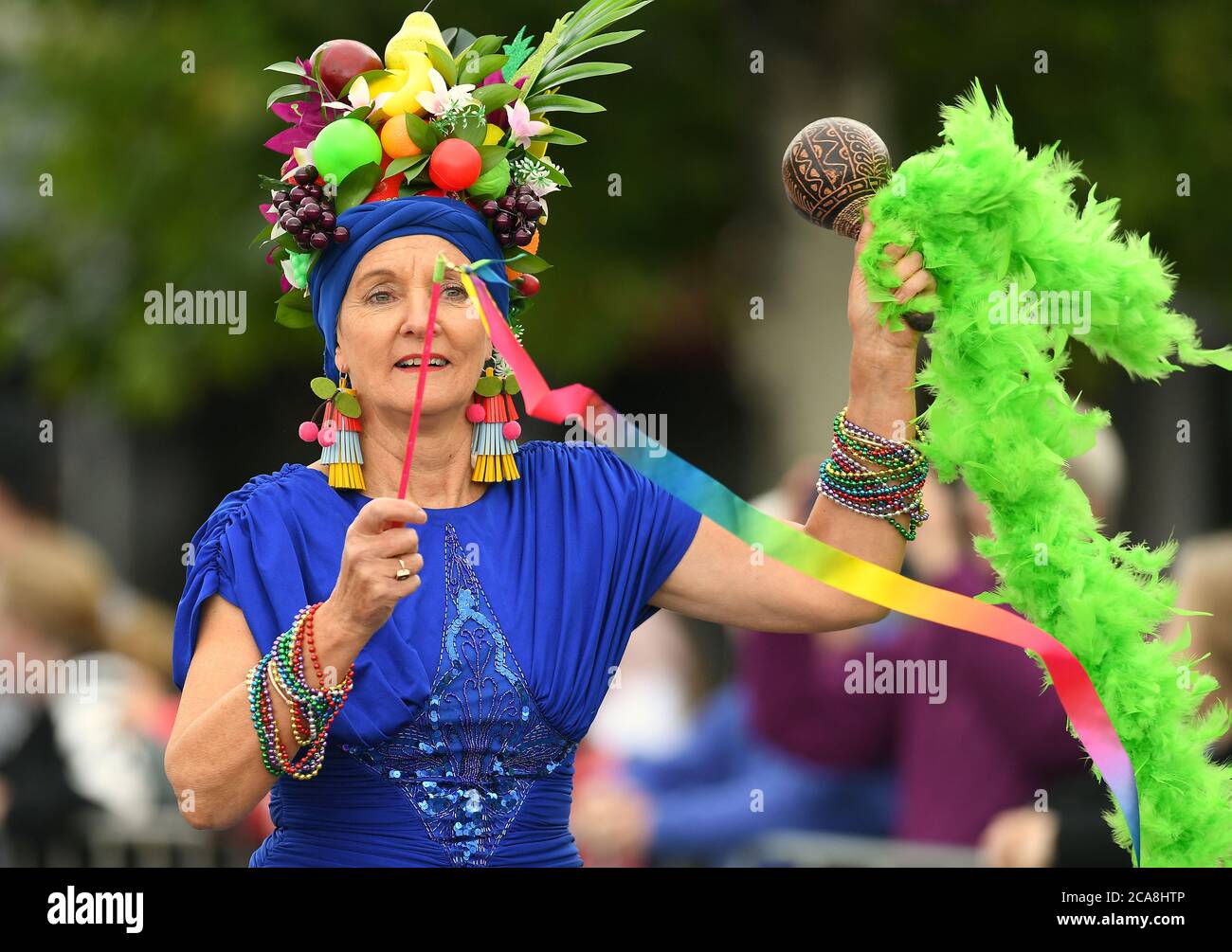 Benalla Festival 2019. A brightly dressed woman with fruit on her head. Stock Photo