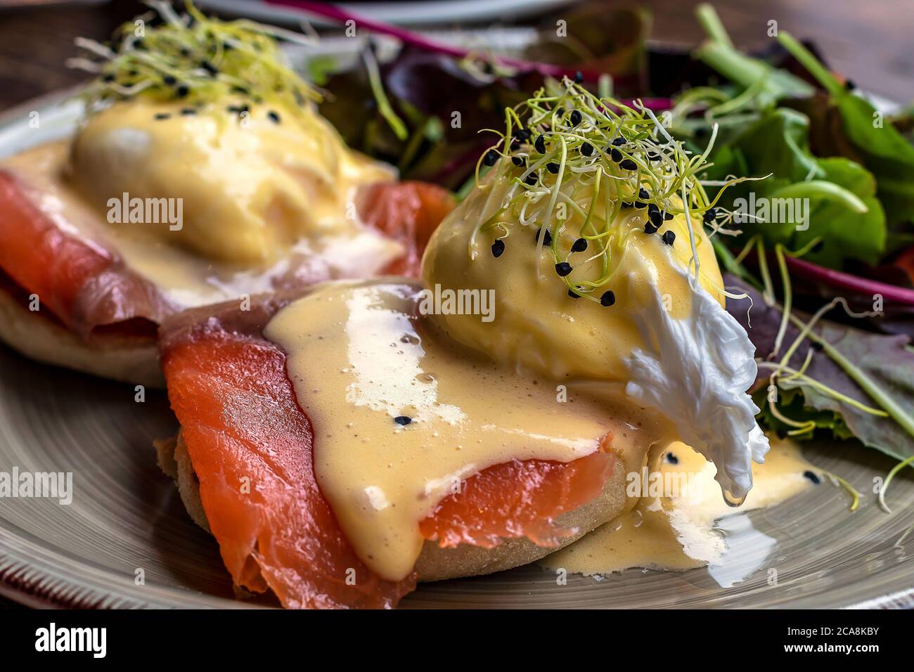 Egg Benedict with smoked salmon and fresh Hollandaise sauce Stock Photo