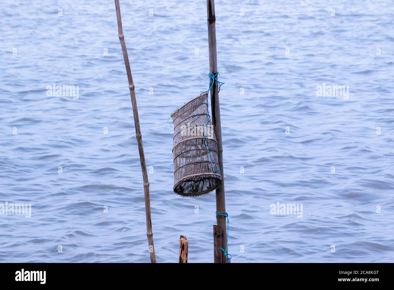 Bamboo fish-trap with a narrow neck - Bangladeshi traditional fishery tool Stock Photo