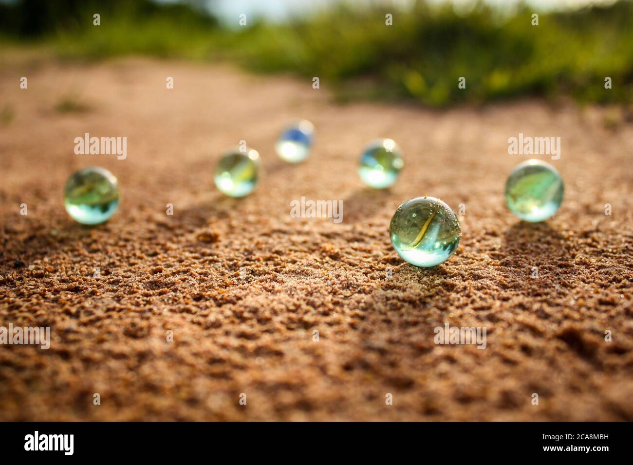 you can see marbles on a sandy floor Stock Photo