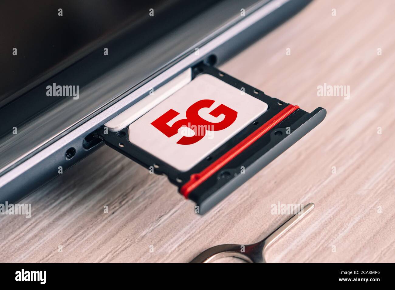 SIM card labeled 5g. Replacing a SIM card in mobile phone with high