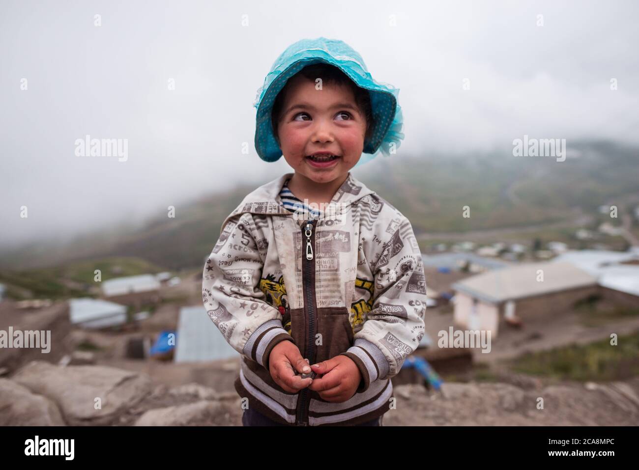 Xinaliq / Azerbaijan - July 8, 2019: Portrait of cute beautiful girl in mountain village in Caucasus Stock Photo