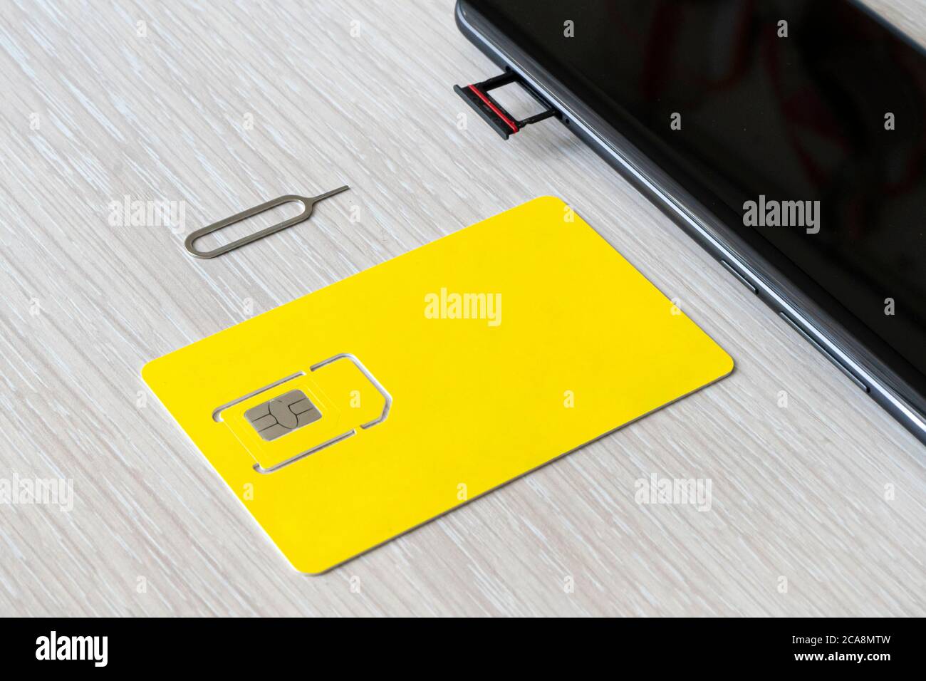 Replacement of nano sim card chip in modern smartphone, Close-up view. copyspace, empty space for design and lettering Stock Photo