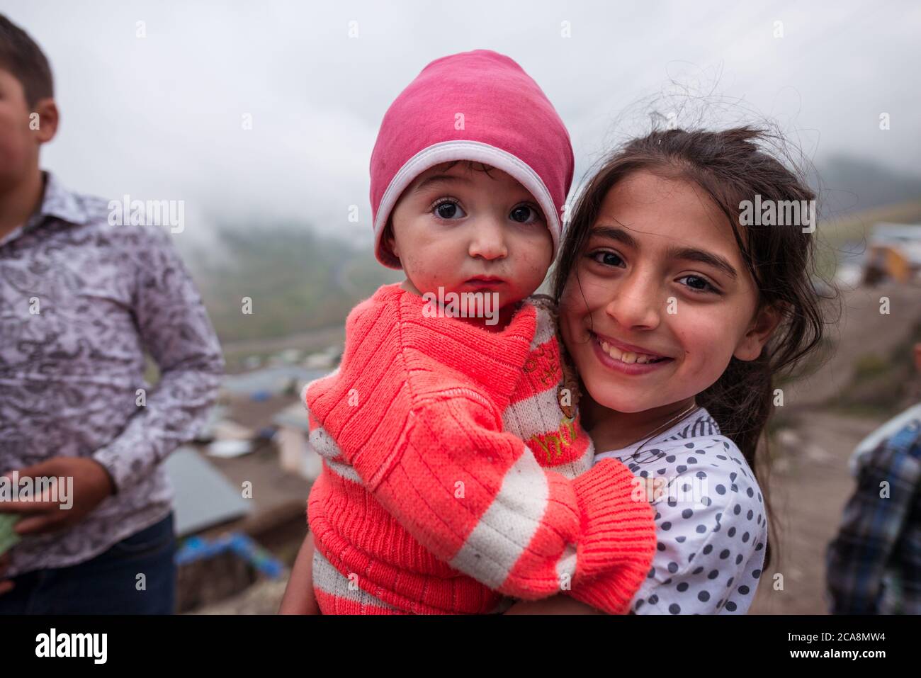 Xinaliq / Azerbaijan - July 8, 2019: Portrait of cute beautiful girl in mountain village in Caucasus Stock Photo