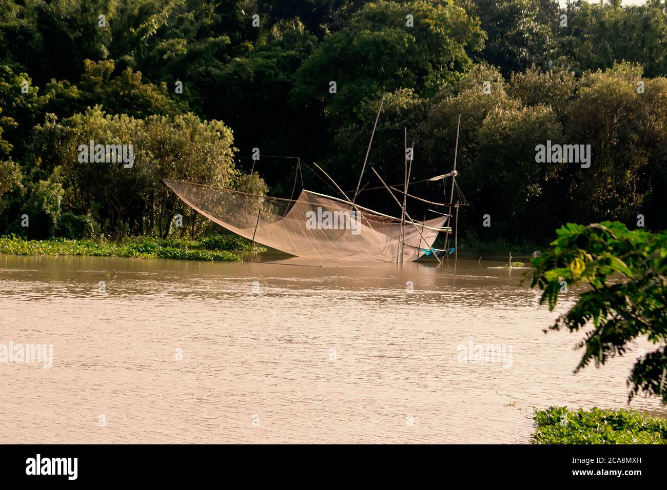 Fishermen put square dip net, kind of fish-trap Stock Photo