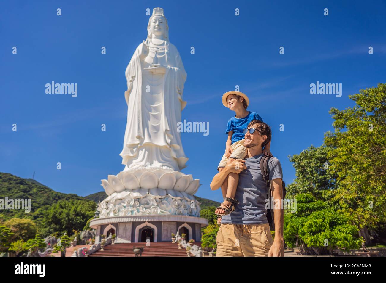 Dad and son tourists in Chua Linh Ung Bai But Temple, Lady Buddha Temple in Da Nang, Vietnam. Traveling with children concept Stock Photo