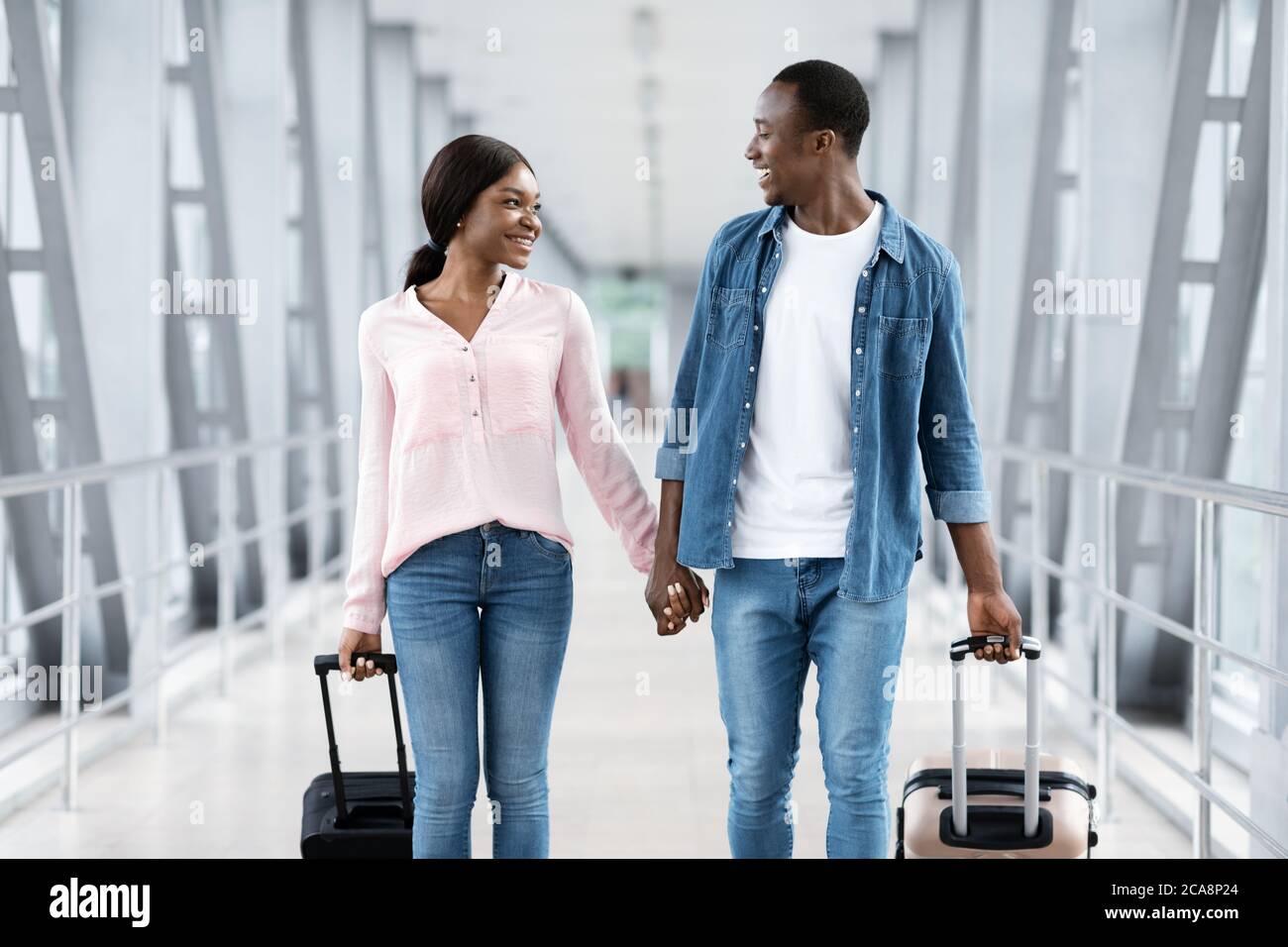 Just Married Black Couple Walking With Suitcases In Airport, Going To ...