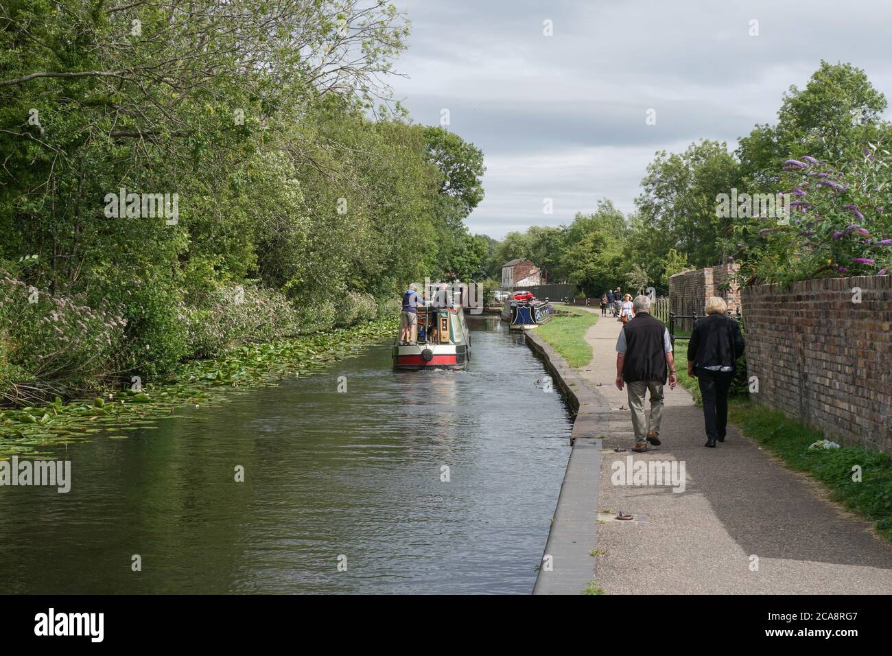 Barge cruising on the Stourbridge Canal near the Bonded Warehouse. West Midlands, Black Country. England. UK Stock Photo