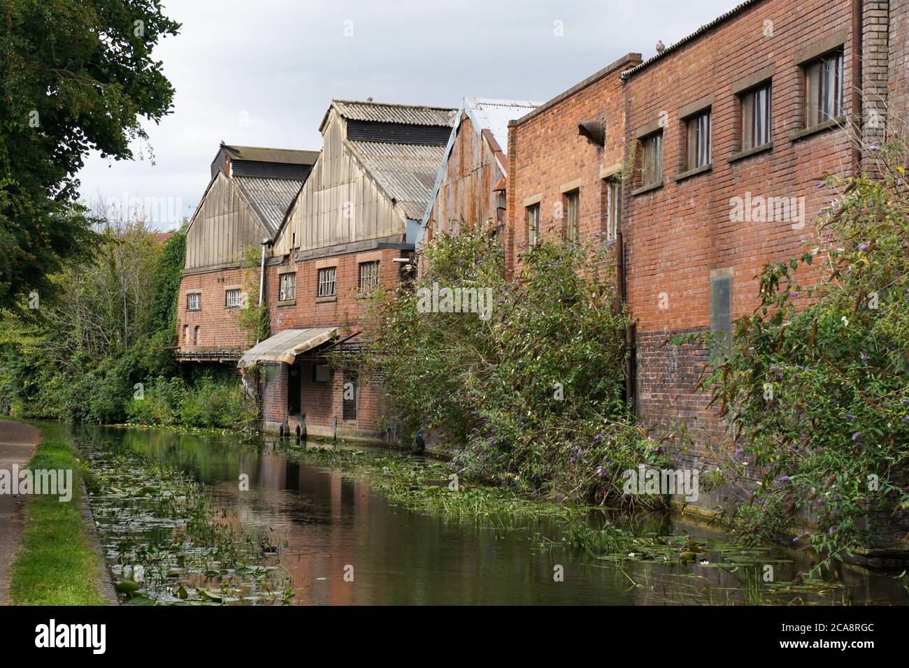 Old factory buildings backing on to the Stourbridge Canal. Black Country. West Midlands. England. UK Stock Photo
