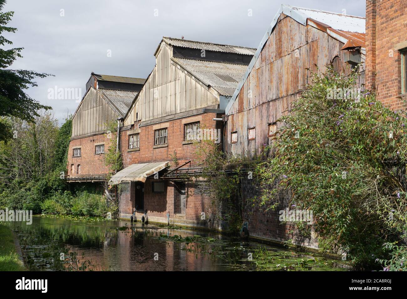 Old factory buildings backing on to the Stourbridge Canal. Black Country. West Midlands. England. UK Stock Photo
