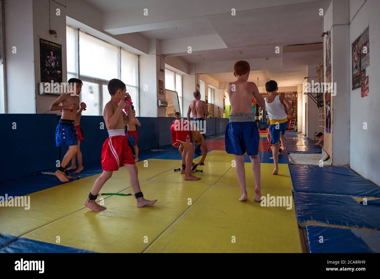 Baku / Azerbaijan - June 7, 2019: kids practicing martial arts in gym interior Stock Photo