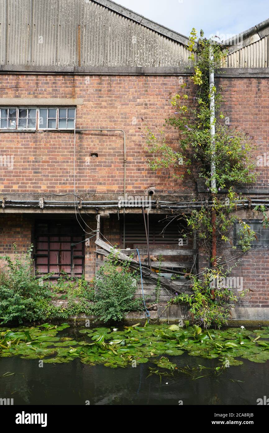 Old factory buildings backing on to the Stourbridge Canal. Black
