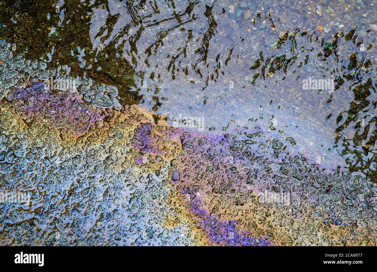 Gasoline flows on the pavement. Stock Photo