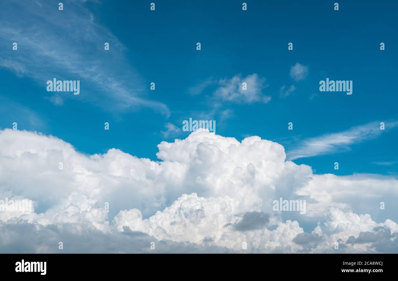 White fluffy clouds on blue sky. Soft touch feeling like cotton. White puffy clouds cape with space for text. Beauty in nature. Close-up white cumulus Stock Photo