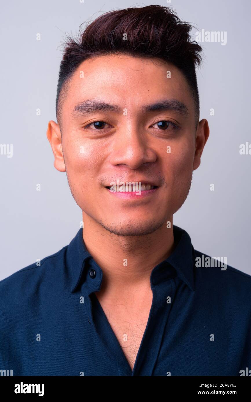 Young asian businessman smiling hi-res stock photography and images - Alamy