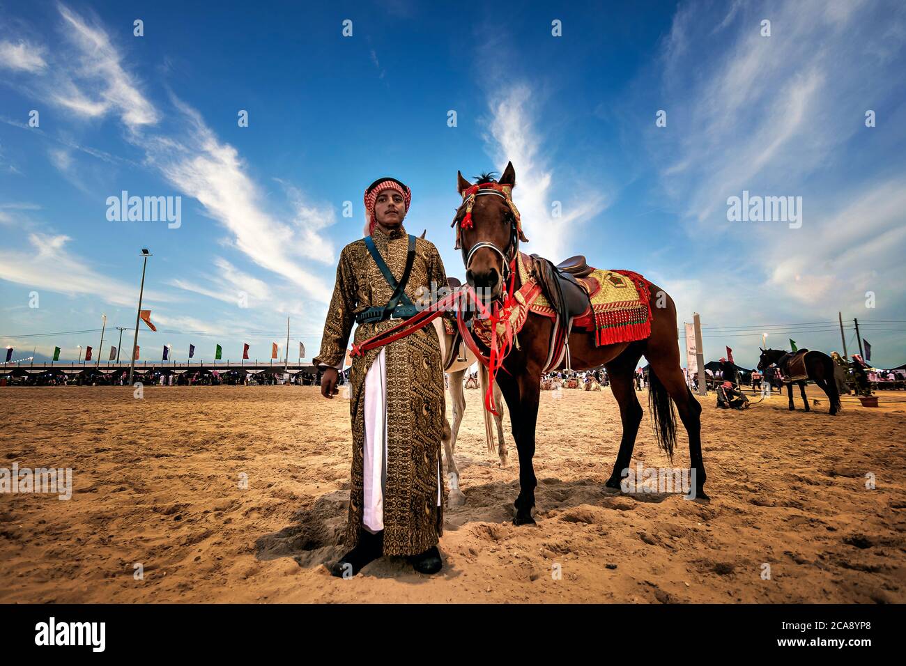 Saudi Arab Horse rider with his horse on traditional desert safari ...