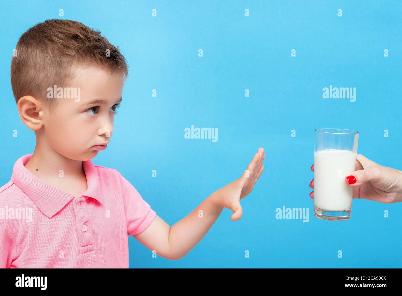 Lactose intolerance. Little kid refusing to drink milk Stock Photo Alamy