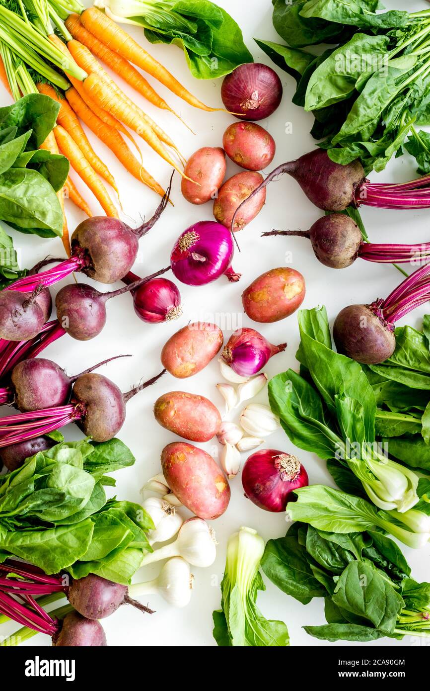 Carrot Potato Beet Onion And Spinach On White Background Top View Carrot Potato Beet Onion And Spinach On White Background Top View