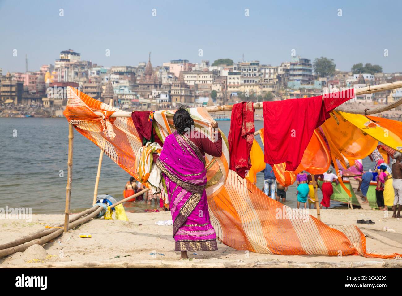 Hanging up washing on banks of Ganges River, Varanasi, Uttar Pradesh, India, Asia Stock Photo