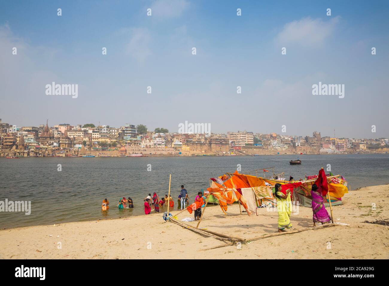 Hanging up washing on banks of Ganges River, Varanasi, Uttar Pradesh, India, Asia Stock Photo