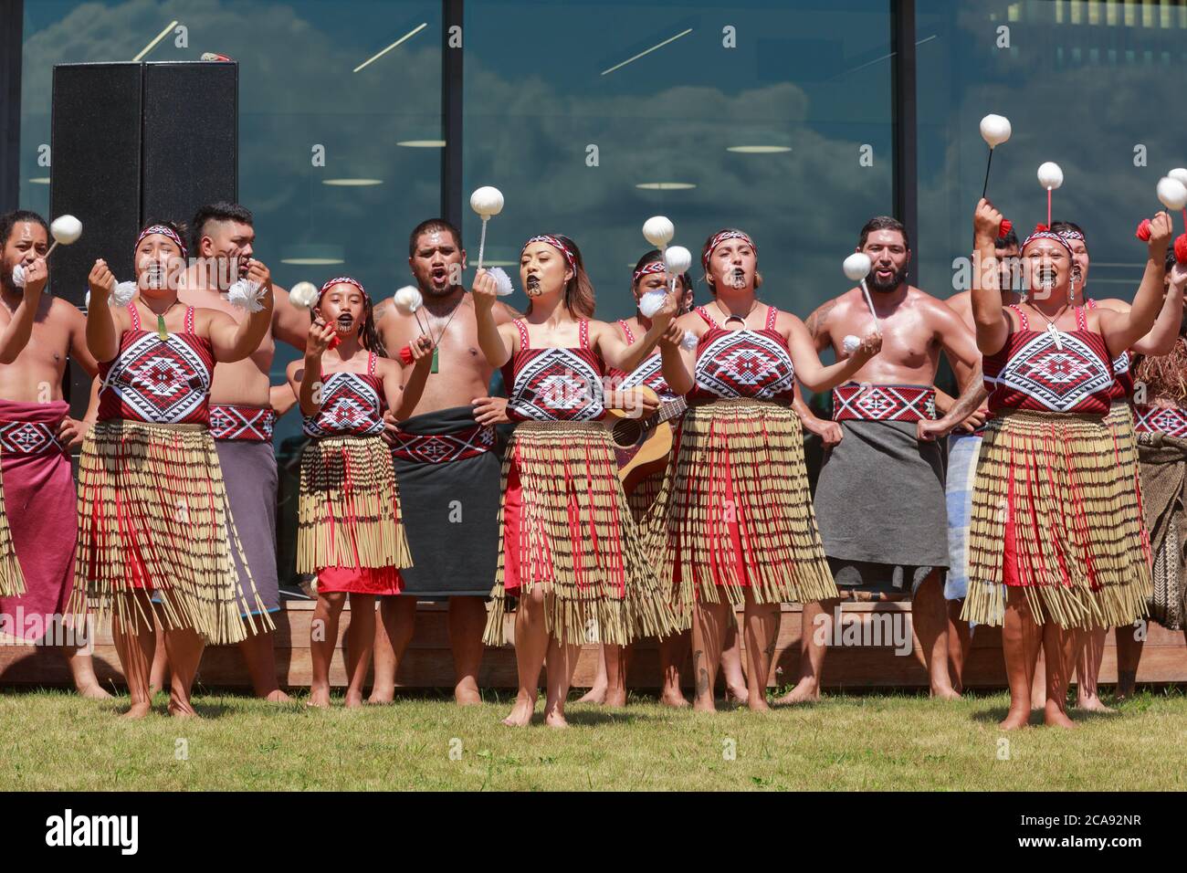 New Zealand Maori women and girls of a kapa haka (traditional dance) group performing a poi dance. Tauranga, New Zealand, February 6 2019 Stock Photo