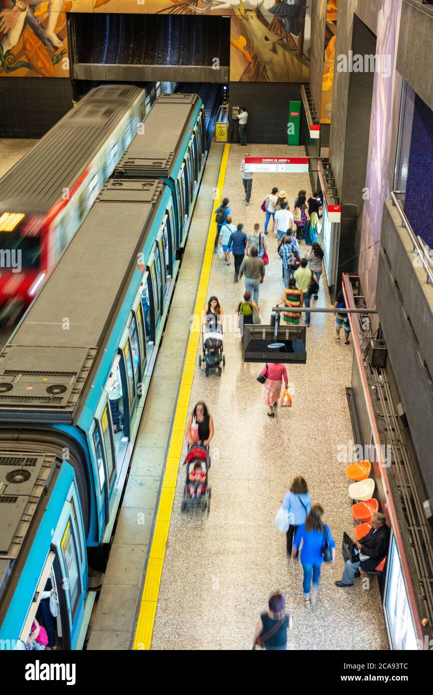 A subway station showing a train and commuter platform on the Metro de Santiago rapid transit system station, Santiago, Chile, South America Stock Photo
