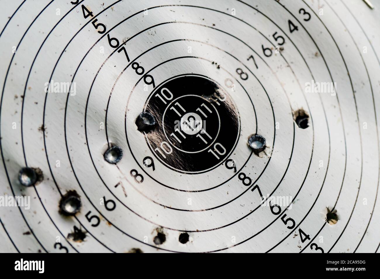 Used shooting target with traces of hit bullets Stock Photo Alamy