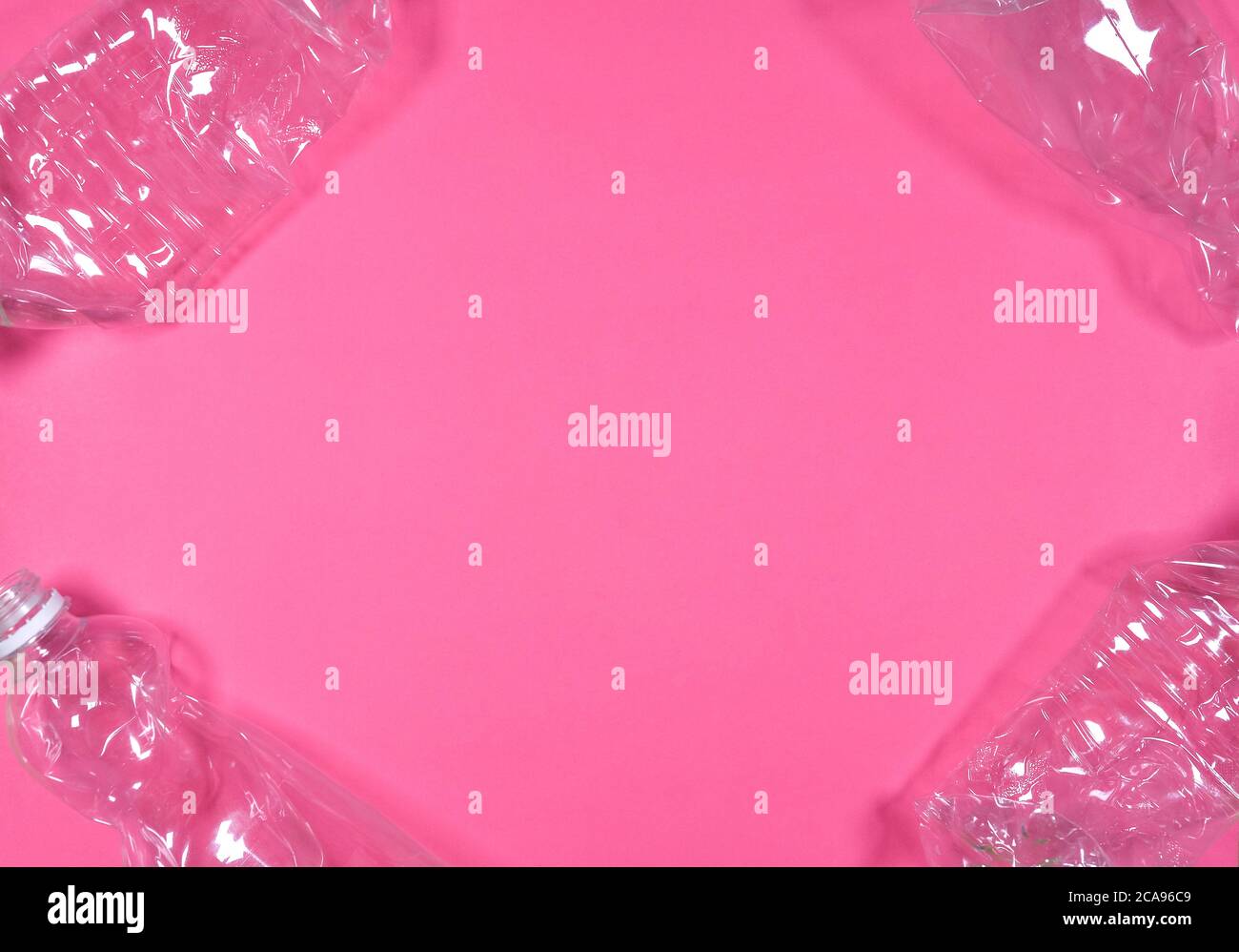 Plastic bottles isolated on pink background. Recycle waste management ...