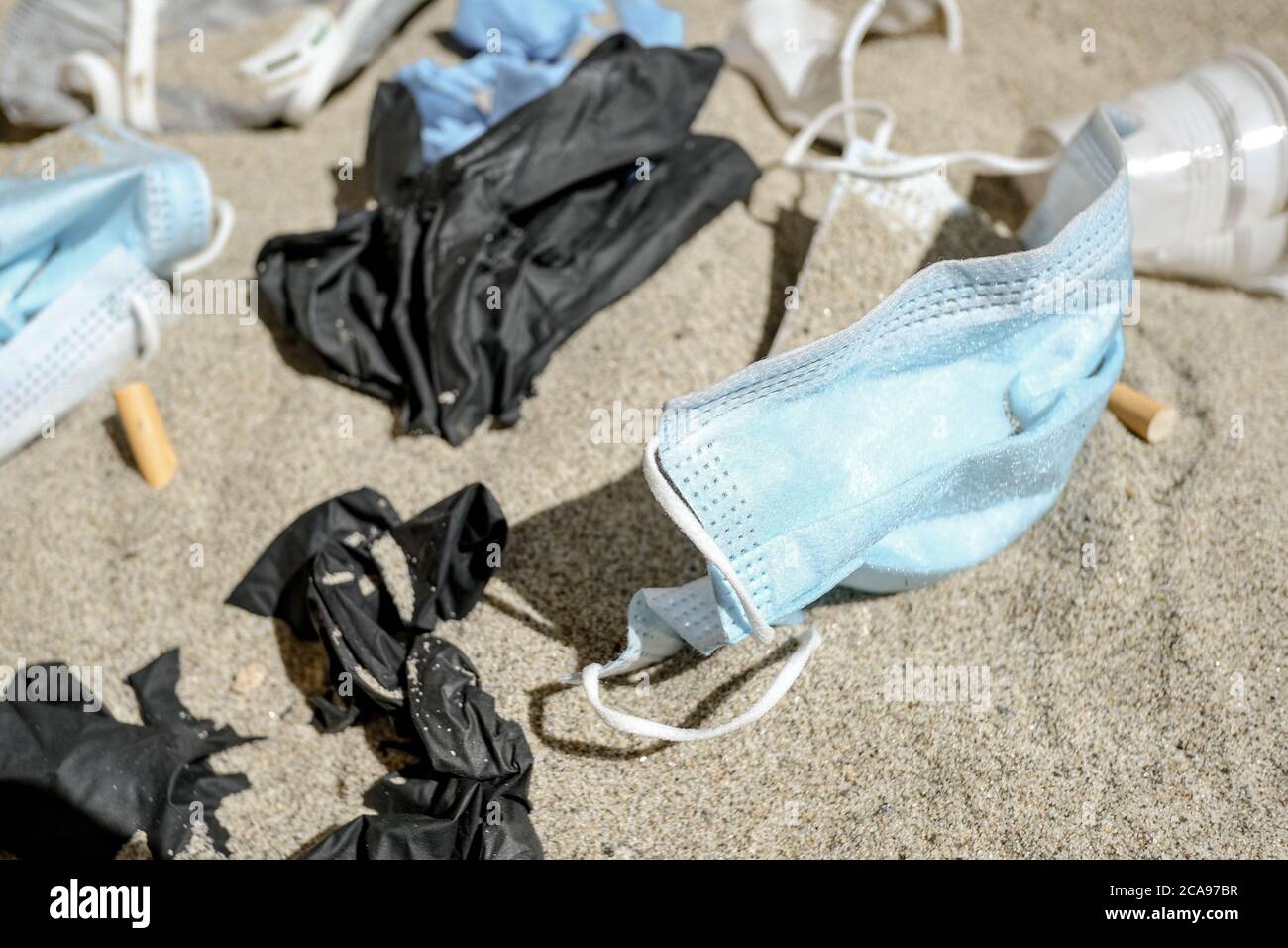 Hospital trash waste,disposable medical garbage on sea coast,covid sea pollution Stock Photo