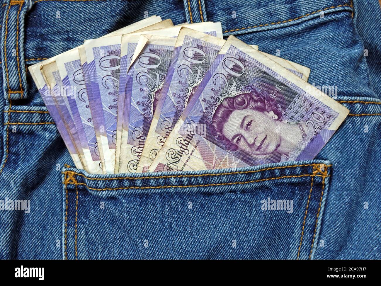 Money in your back pocket, black economy,cash in hand jobs,gig economy, cash in hand work,Report a business or your employer to HMRC Stock Photo