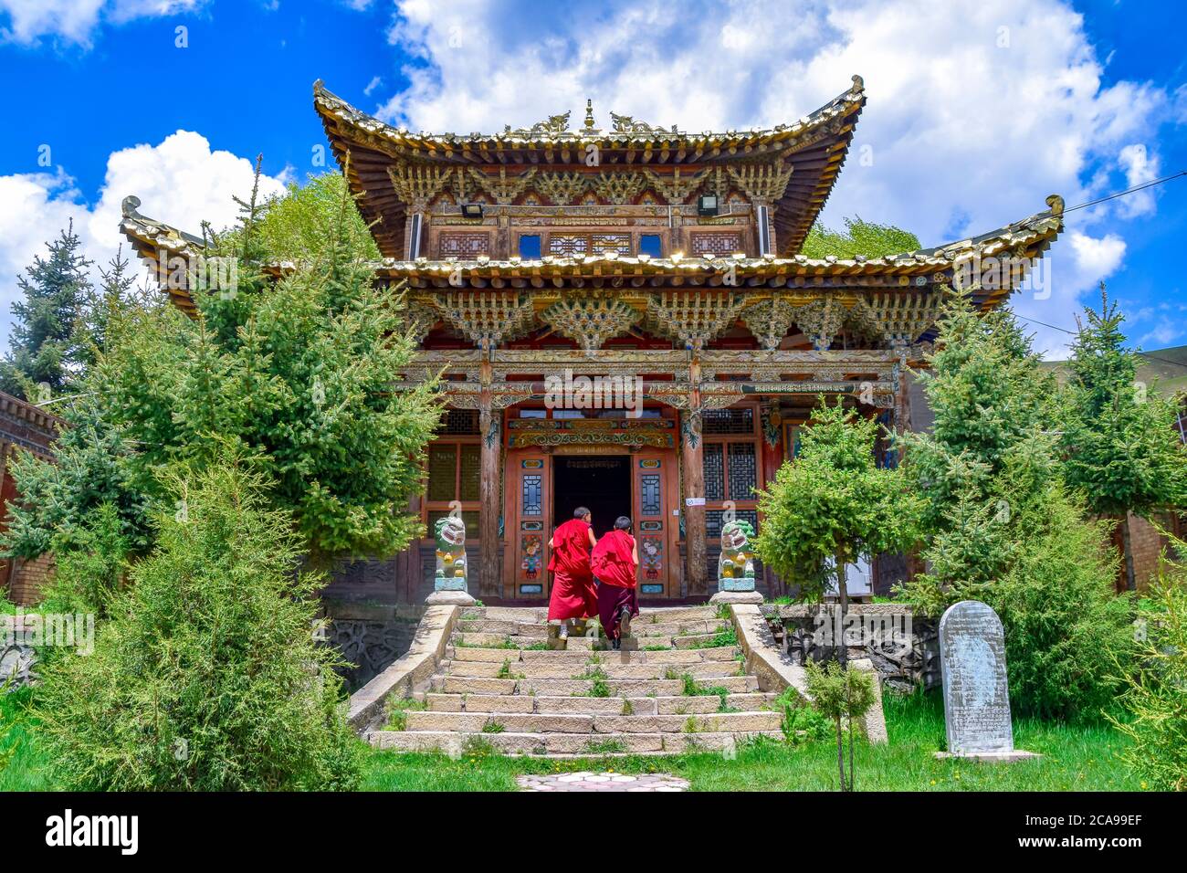 lama going towards the Tibetan Buddhist monastery Arou Temple.A famous historic site in Qilian,Qinghai China. Stock Photo