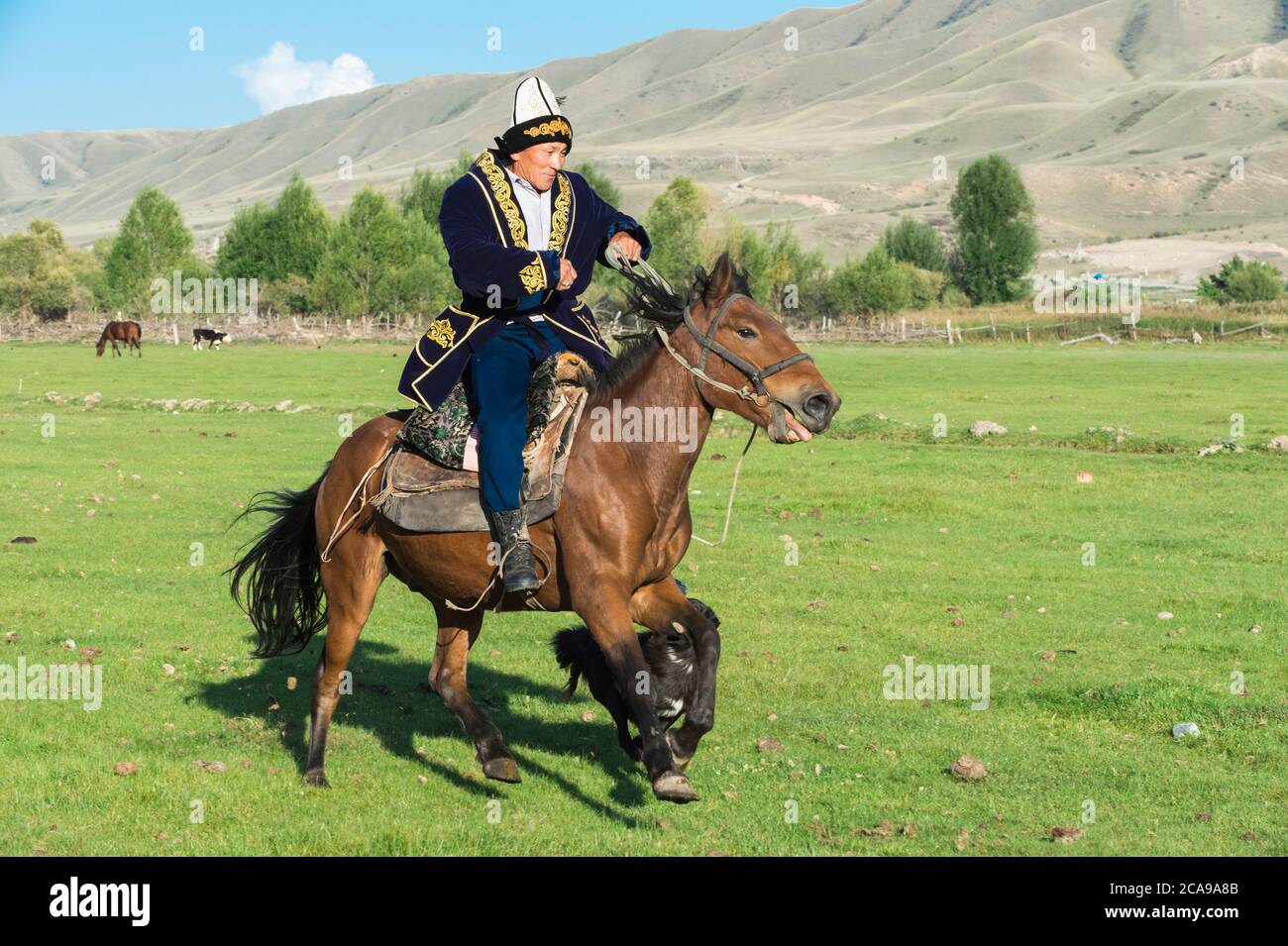 Kazakh Rider In Traditional Clothes Sati Village Tien Shan Mountains kazakh-rider-in-traditional-clothes-sati-village-tien-shan-mountains