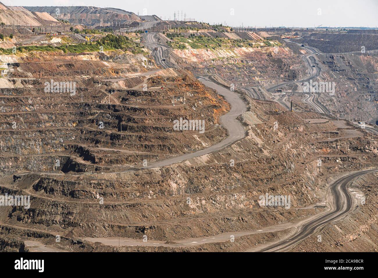 an iron ore quarry, a road of stepped terraced relief, Mining industry