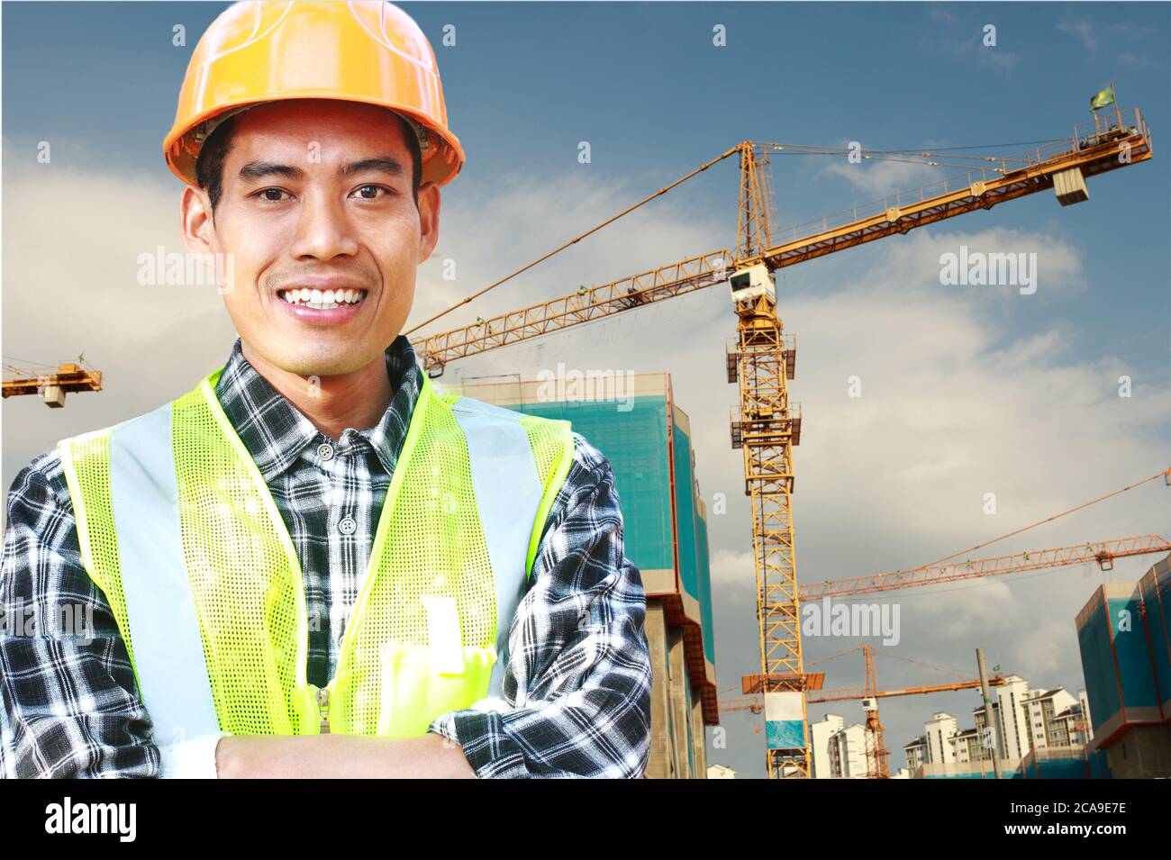Portrait of man construction worker standing front of wall construction