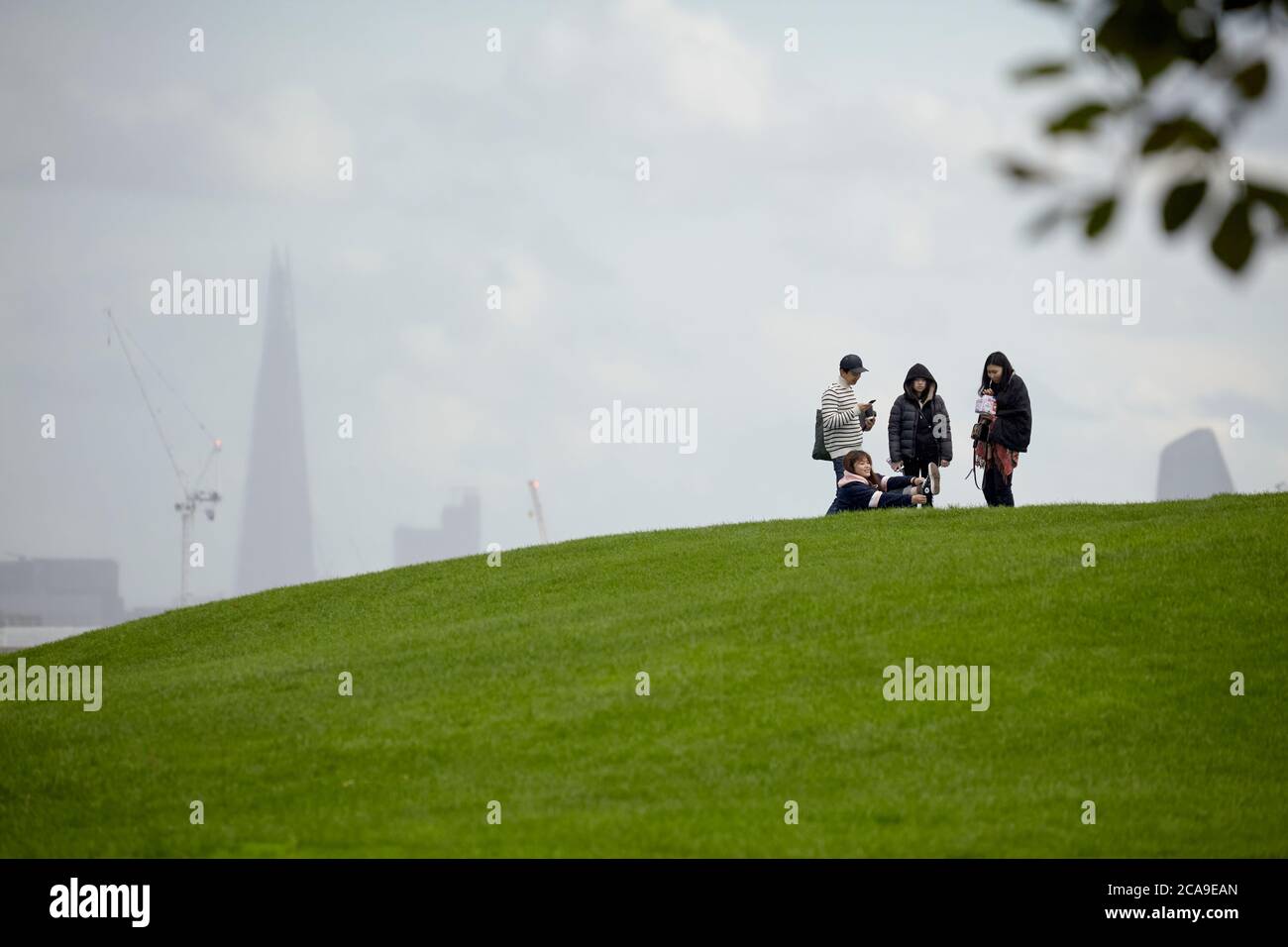 London Skyline with tourists seen from Primrose Hill Stock Photo