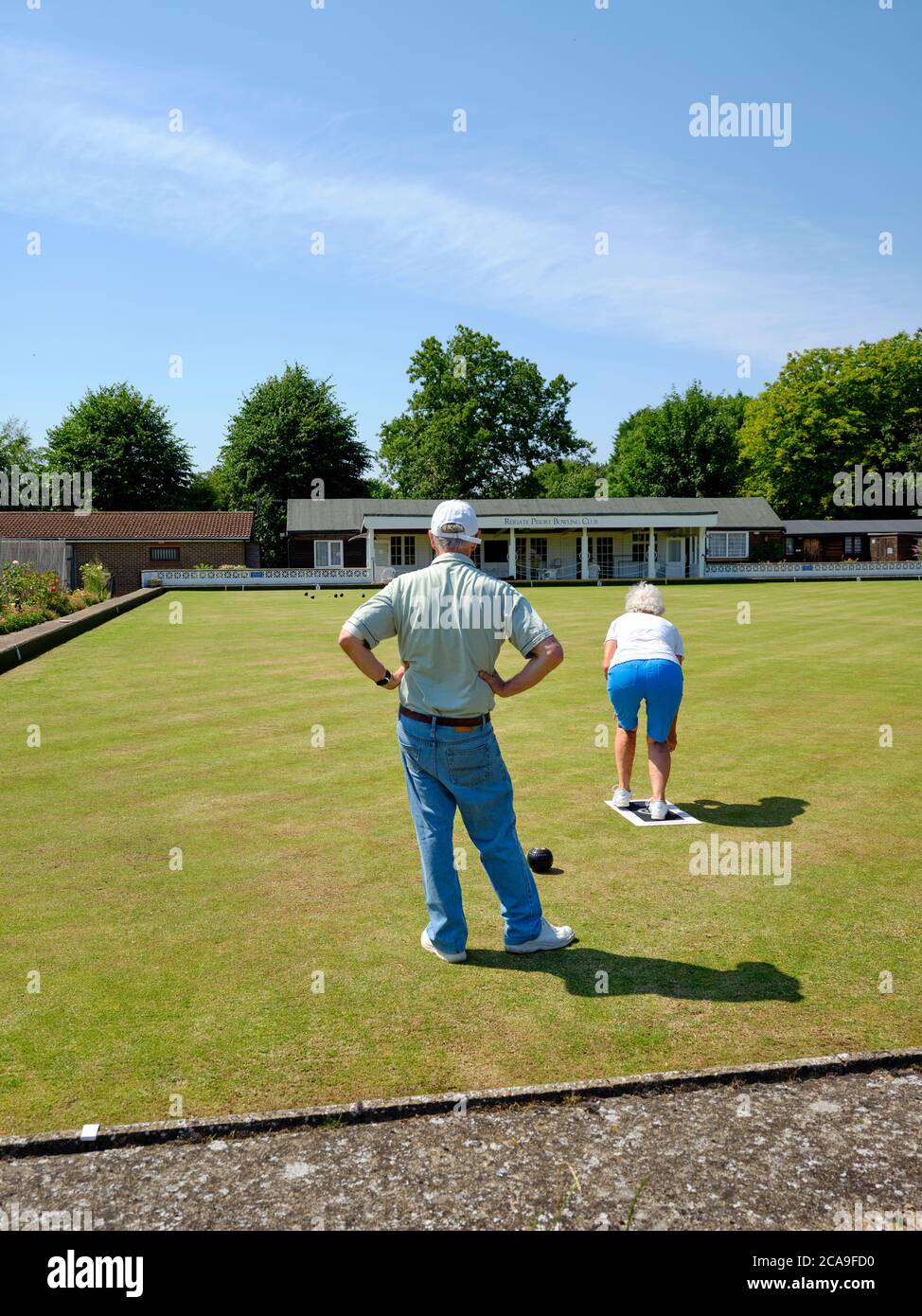 Members practicing their bowls on the bowling green at Reigate Priory Bowling Club - Reigate Surrey England UK - British retirement outdoor activity Stock Photo