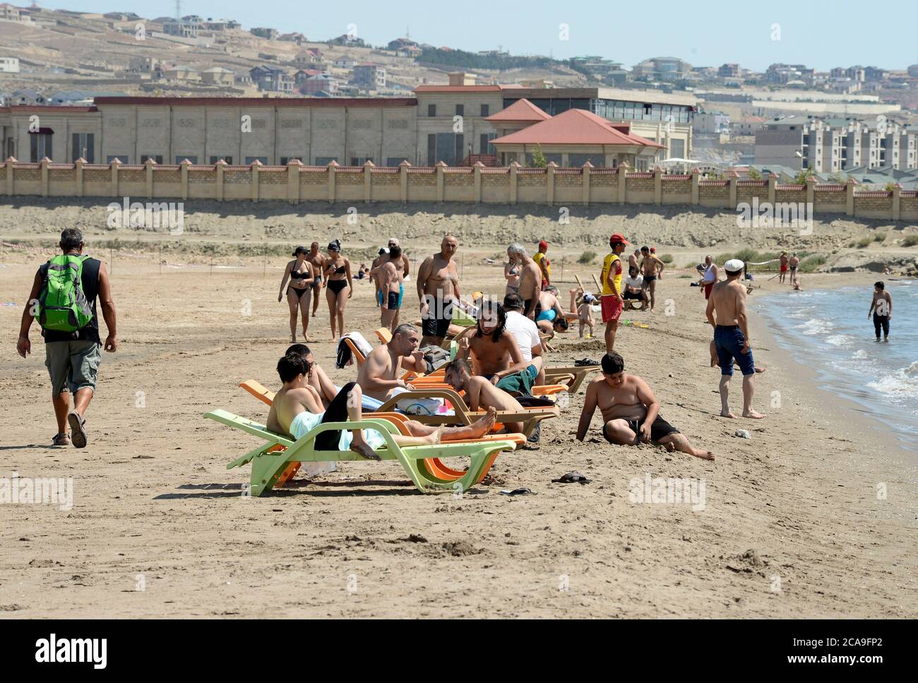 Baku, Azerbaijan. 5th Aug, 2020. Beachgoers relax on the Caspian sea