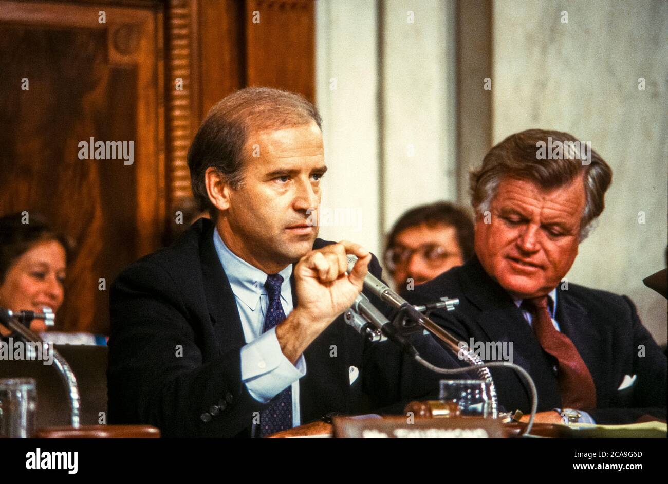 United States Senator Joseph Biden (Democrat of Delaware), Chairman, US Senate Committee on the Judiciary, makes remarks as he chairs the confirmation vote for Judge Robert Bork, US President Ronald Reagan's nominee to succeed Associate Justice of the Supreme Court Louis Powell on Capitol Hill in Washington, DC on October 6, 1987. US Senator Edward M. “Ted” Kennedy (Democrat of Massachusetts) looks on from right.Credit: Ron Sachs/CNP | usage worldwide Stock Photo