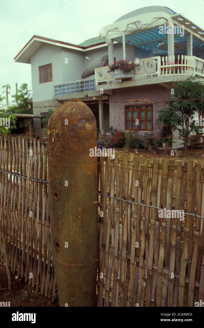 Bombs decoration in front of a house the centre of the Town of Phonsavan in the Province Xieng Khunag in Lao in the north of Lao.   Lao, Phonsavan, Ju Stock Photo