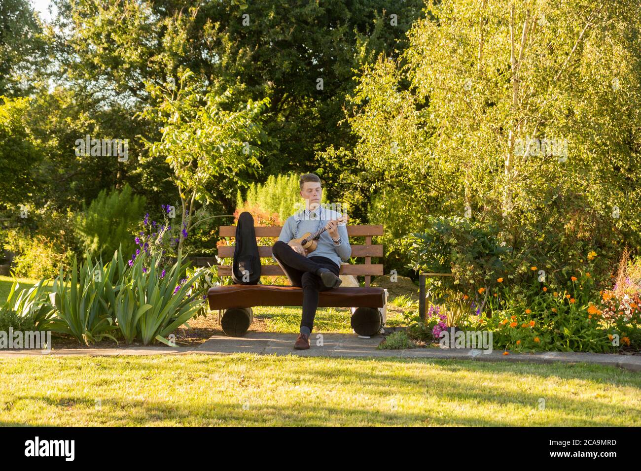Young man playing ukulele. Stock Photo