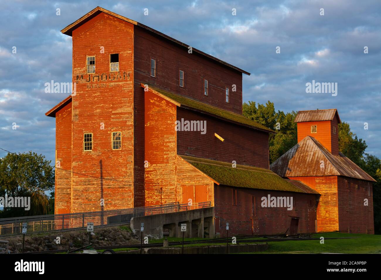 Old grain elevator in the Midwest at sunrise. Seneca, Illinois Stock