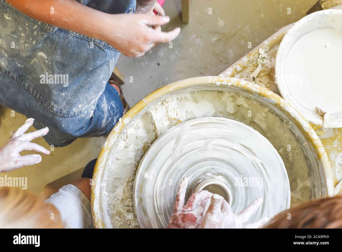 Children making pottery during ceramic lesson with clay Stock Photo Alamy