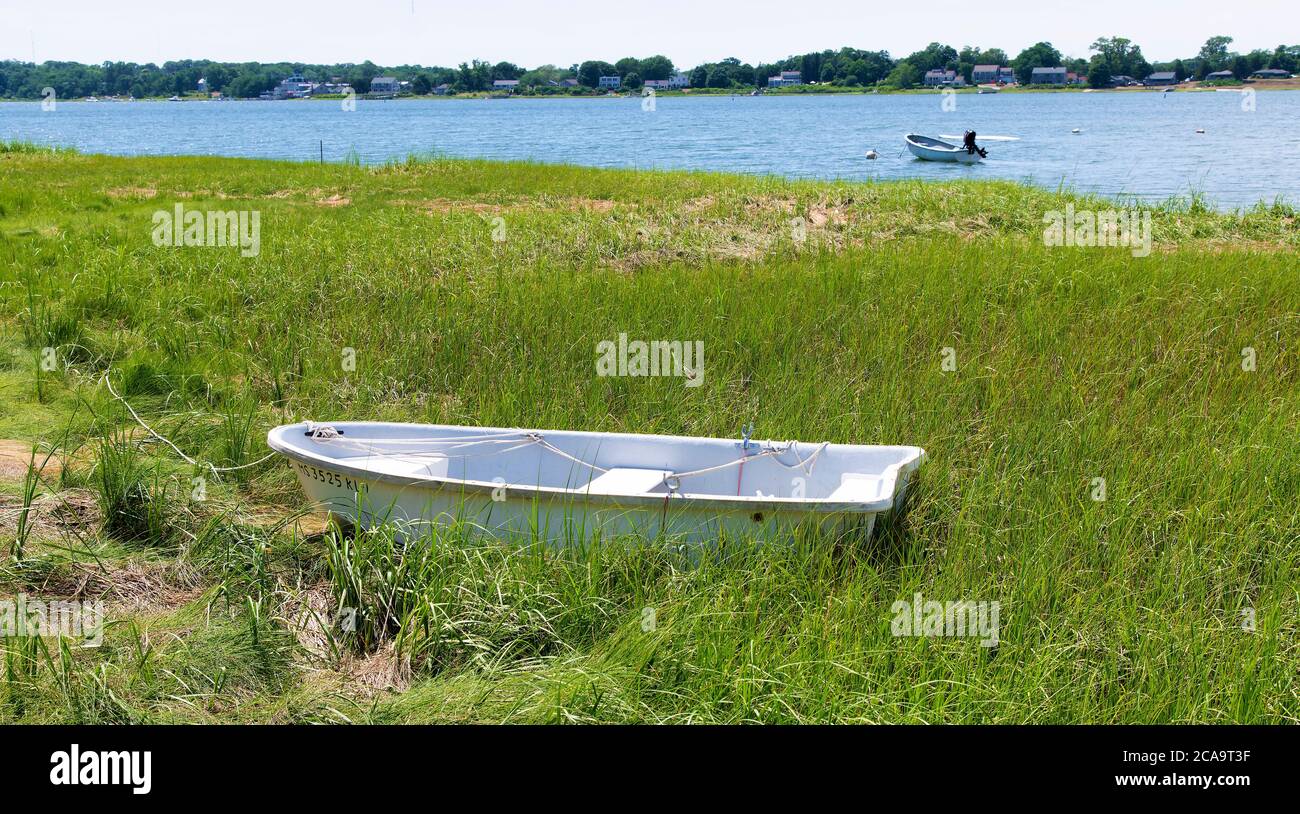 A rowboat in marsh grass on Cape Cod, USA Stock Photo